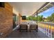 Cozy covered patio area with seating, perfect for outdoor dining and relaxation at 7629 S Fillmore Way, Centennial, CO 80122