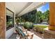 Relaxing front porch with comfortable seating, lush greenery, and charming curb appeal at 7629 S Fillmore Way, Centennial, CO 80122