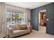 A cozy sitting area featuring a neutral colored sofa and view of the outdoors at 7629 S Fillmore Way, Centennial, CO 80122