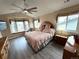 Vaulted bedroom featuring a bay window, ceiling fan, and unique decor at 227 Powderhorn Trl, Broomfield, CO 80020