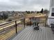 A spacious deck overlooks green spaces in a residential neighborhood at 227 Powderhorn Trl, Broomfield, CO 80020