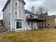 The two-story home features an elevated deck, well-maintained lawn, and neutral siding at 227 Powderhorn Trl, Broomfield, CO 80020