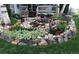 Landscaped front yard with colorful flowers and rock accents creates a welcoming entrance at 227 Powderhorn Trl, Broomfield, CO 80020