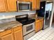 Kitchen with stainless steel appliances, modern cabinetry, and granite countertops at 227 Powderhorn Trl, Broomfield, CO 80020