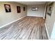 Spacious room with wood-look flooring and decorative wall art at 227 Powderhorn Trl, Broomfield, CO 80020