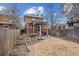 Brick home featuring pergola, patio, and landscaping in the backyard, perfect for outdoor entertaining at 1939 W 39Th Ave, Denver, CO 80211