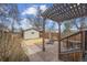 Backyard space with an outdoor dining area under a pergola and partial fencing at 1939 W 39Th Ave, Denver, CO 80211