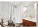 Charming bathroom with a clawfoot tub, vintage fixtures, and plenty of natural light at 1939 W 39Th Ave, Denver, CO 80211