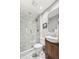 Modern bathroom featuring a glass walk-in shower with rainfall shower head, and blue patterned tile floors at 1939 W 39Th Ave, Denver, CO 80211