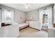 Sunlit bedroom with a soft color scheme, creating a calming space with large windows at 1939 W 39Th Ave, Denver, CO 80211