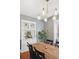 Elegant dining room with hardwood floors, modern lighting, and a charming built-in cabinet at 1939 W 39Th Ave, Denver, CO 80211