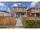 Charming brick home featuring a welcoming front porch and well-maintained landscaping at 1939 W 39Th Ave, Denver, CO 80211