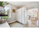 Mud room with lots of windows for lighting, tile floors, and storage, leading into the kitchen at 1939 W 39Th Ave, Denver, CO 80211