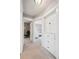 Hallway with doors leading to bedrooms and built-in storage space at 1939 W 39Th Ave, Denver, CO 80211