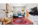 Comfortable living room featuring a fireplace, hardwood floors, and ample natural light at 1939 W 39Th Ave, Denver, CO 80211