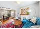 Stylish living room with hardwood floors, fireplace, and bright windows with dining area at 1939 W 39Th Ave, Denver, CO 80211