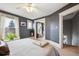 A view from the main bedroom with light streaming in, looking towards the closet and stairs at 1939 W 39Th Ave, Denver, CO 80211