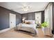 Spacious main bedroom featuring a ceiling fan, ample natural light and a relaxing color palette at 1939 W 39Th Ave, Denver, CO 80211