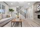 Inviting living room with a modern staircase, comfortable seating, and stylish accents at 7547 S Patsburg Way, Aurora, CO 80016