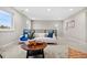 Upstairs living area featuring a cozy sofa, bright natural light, and stylish decor at 7547 S Patsburg Way, Aurora, CO 80016