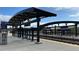 A modern light rail station featuring a black metal canopy and clean, accessible platforms at 14497 E 1St Dr # B3, Aurora, CO 80011
