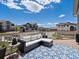 Inviting deck with outdoor seating, a stylish rug, and scenic views of neighboring houses at 10258 W Coal Mine Pl, Littleton, CO 80127