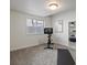 Well-lit exercise room with fitness equipment, neutral walls, and shelving for storage at 10258 W Coal Mine Pl, Littleton, CO 80127