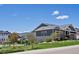 Charming home with a well-maintained lawn, mature trees, and a welcoming front entrance at 10258 W Coal Mine Pl, Littleton, CO 80127