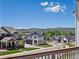 Scenic neighborhood view showcasing well-maintained homes, green lawns, and mountain views in the background at 10258 W Coal Mine Pl, Littleton, CO 80127