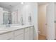 Bathroom featuring a double vanity, framed mirrors, and a glass enclosed shower at 11330 Pacific Peak Ct, Parker, CO 80134