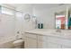 Bright full bathroom with shower/tub, window, and large vanity at 11330 Pacific Peak Ct, Parker, CO 80134
