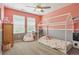 Cozy bedroom with playful decor, soft carpet and a large window at 11330 Pacific Peak Ct, Parker, CO 80134
