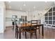 Open-concept dining area with an adjacent modern kitchen, perfect for entertaining guests at 11330 Pacific Peak Ct, Parker, CO 80134