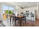 Dining area with a large window and access to the kitchen with stainless steel appliances at 11330 Pacific Peak Ct, Parker, CO 80134
