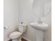 Clean half bathroom features a pedestal sink and modern fixtures at 11330 Pacific Peak Ct, Parker, CO 80134