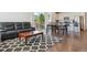 Open-concept living area with an adjacent dining table, perfect for entertaining guests at 11330 Pacific Peak Ct, Parker, CO 80134