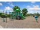 Community playground featuring green and blue play structures and a wood chip ground at 11330 Pacific Peak Ct, Parker, CO 80134