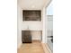 Stylish bar area with sleek brown cabinetry, a sink, light countertop, and access to the patio at 2685 S Acoma St, Denver, CO 80223