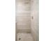 Elegant walk-in shower with neutral tile and rain shower head at 2685 S Acoma St, Denver, CO 80223