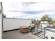 Outdoor deck with stone table and chairs with city views at 2685 S Acoma St, Denver, CO 80223