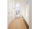 Hallway with hardwood floors and built-in bench at 2685 S Acoma St, Denver, CO 80223