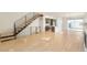 Spacious open floor plan with hardwood flooring and modern staircase at 2685 S Acoma St, Denver, CO 80223