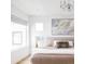 Comfortable main bedroom with a warm color palette and contemporary art at 2685 S Acoma St, Denver, CO 80223