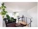 Second story office with dual chairs, desk, and plant decor at 2685 S Acoma St, Denver, CO 80223