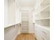 Well-organized walk-in closet with built-in shelving and drawers at 2685 S Acoma St, Denver, CO 80223