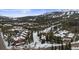 Picturesque aerial shot of a mountain community surrounded by snow-covered trees and slopes at 43 Snowflake Dr # D7, Breckenridge, CO 80424