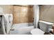Tiled bathroom featuring a shower-tub combination with shower curtain and toilet at 43 Snowflake Dr # D7, Breckenridge, CO 80424