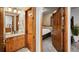 Bright bathroom with vanity and a view into the bedroom with a television at 43 Snowflake Dr # D7, Breckenridge, CO 80424