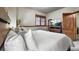 Cozy bedroom featuring a large bed with white linens, a mounted TV, and a window view at 43 Snowflake Dr # D7, Breckenridge, CO 80424