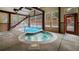 Indoor pool with a tranquil hot tub, all-weather design, and a roll-up door for fresh air and sunshine at 43 Snowflake Dr # D7, Breckenridge, CO 80424